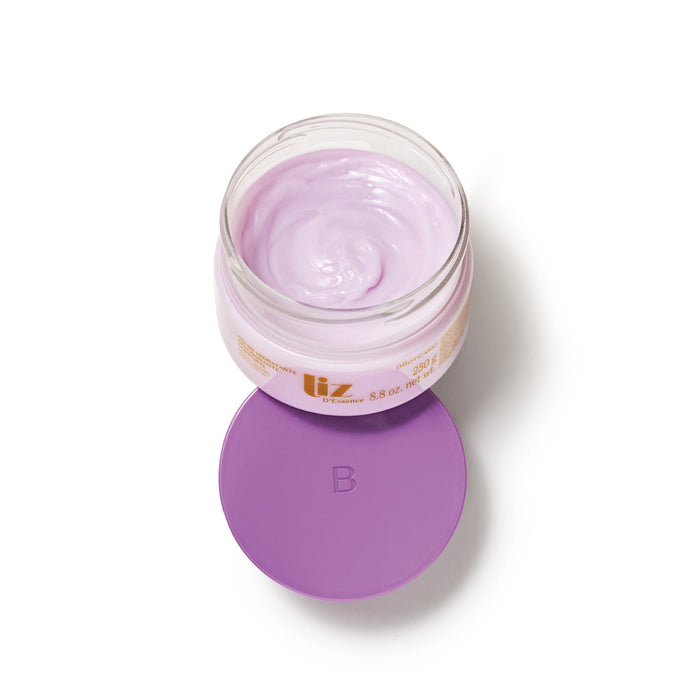 Top view of the opened Boticário Liz D'Essence body cream jar showing the swirled lilac-pink cream texture and purple lid – Buy now at MKPBR.COM – Worldwide Shipping