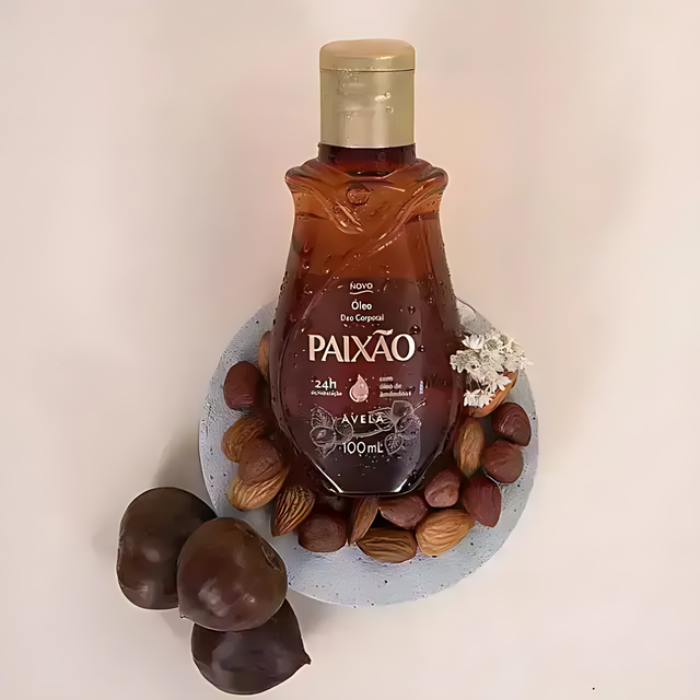 Amber bottle styled with hazelnuts and almonds, Paixão Avelã deodorant body oil. Buy now at MKPBR.COM – Worldwide Shipping