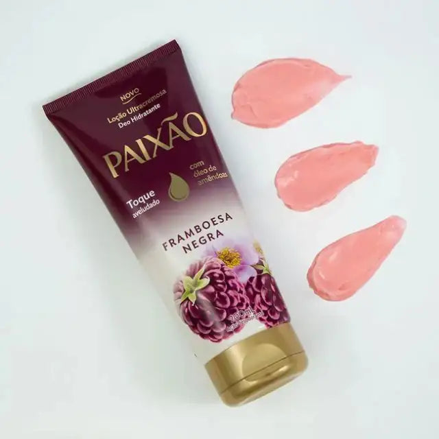 Paixão Framboesa Negra ultra-creamy deodorant moisturizing lotion tube with almond oil, shown with three pink texture swatches on a white background