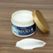 Open jar of Paixão Inspiradora Rosas Brancas body cream with a white cream swatch on a wooden surface — Buy now at MKPBR.COM – Worldwide Shipping