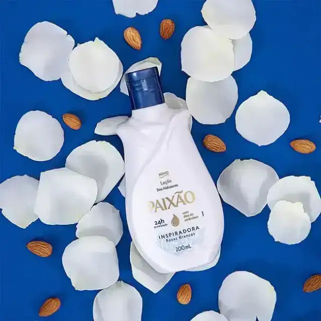 Paixão Inspiradora body lotion 200 ml with almonds and white rose petals on blue background. Buy now at MKPBR.COM – Worldwide Shipping