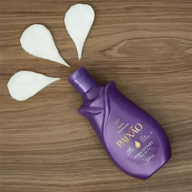 Paixão Irresistível Flor de Lis – tilted purple bottle on dark wooden background with three creamy white lotion streaks fanned out – Buy now at MKPBR.COM – Worldwide Shipping