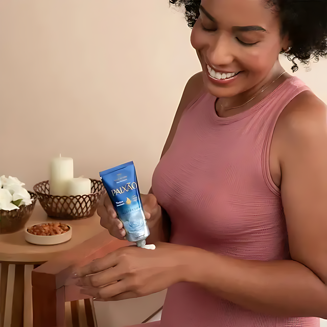 Gentle squeeze of Paixão White Roses Hand Cream tube, revealing the smooth texture of the cream – Buy now at MKPBR.COM – Worldwide Shipping