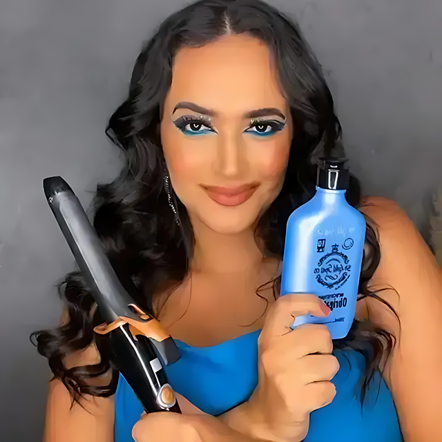 Woman styling with curling iron holding Receitinha Obrigatoria By Gold Spell Co hair cream – Buy now at MKPBR.COM – Worldwide Shipping
