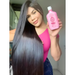 Model holding Gold Spell Efeito Soneca pink shampoo 250ml for hydration and frizz control – Buy now at mkpbr.com – Worldwide Shipping