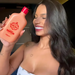 Model smiling while holding Gold Spell Co. Shampeeling exfoliating scalp shampoo 250ml – deep cleansing and revitalization – Available at MKPBR.COM – Worldwide Shipping