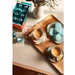 Orfeu Arara Nespresso Compatible Coffee Capsules - A lifestyle flat lay featuring the Orfeu Arara capsule box, a brewed cup, and sweet treats, creating an inviting scene. – Buy now at MKPBR.COM – Worldwide Shipping